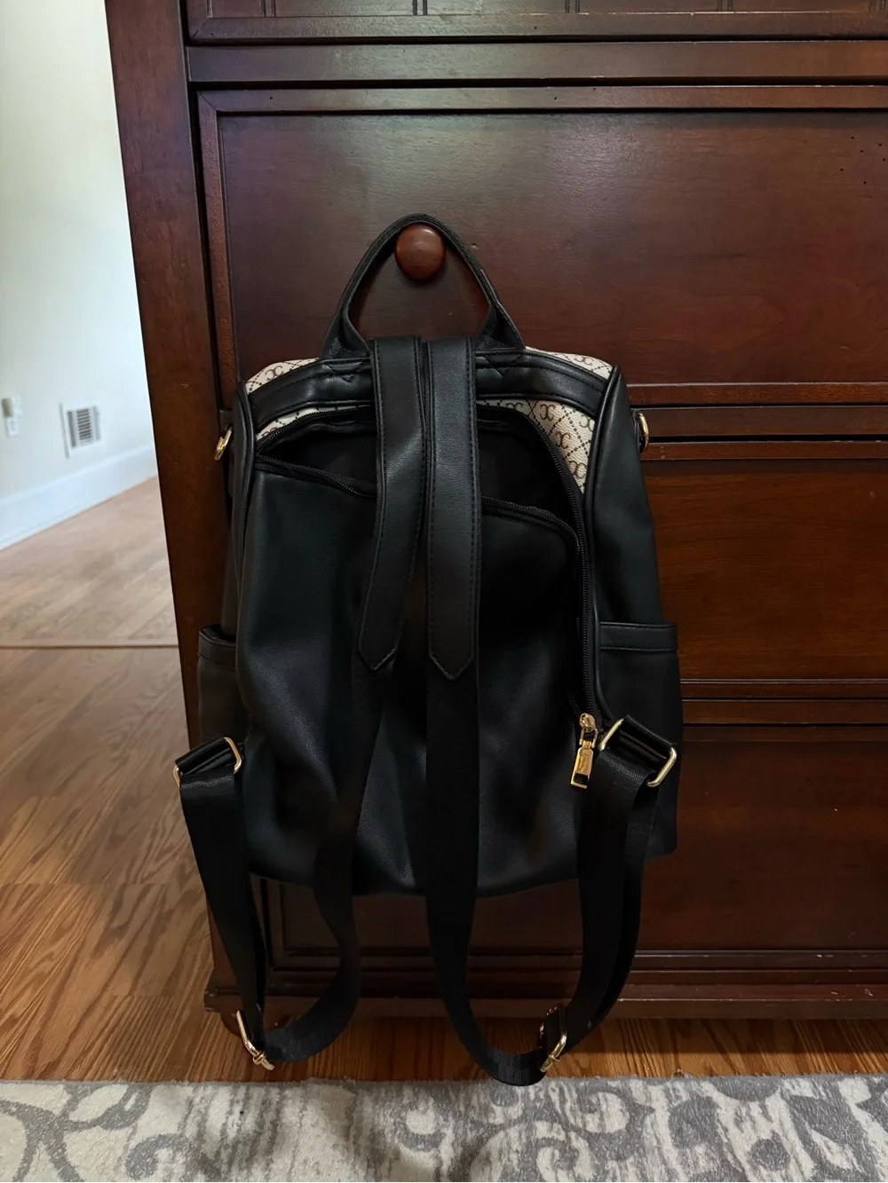 Monogram Canvas Backpack with Black Leather Trim